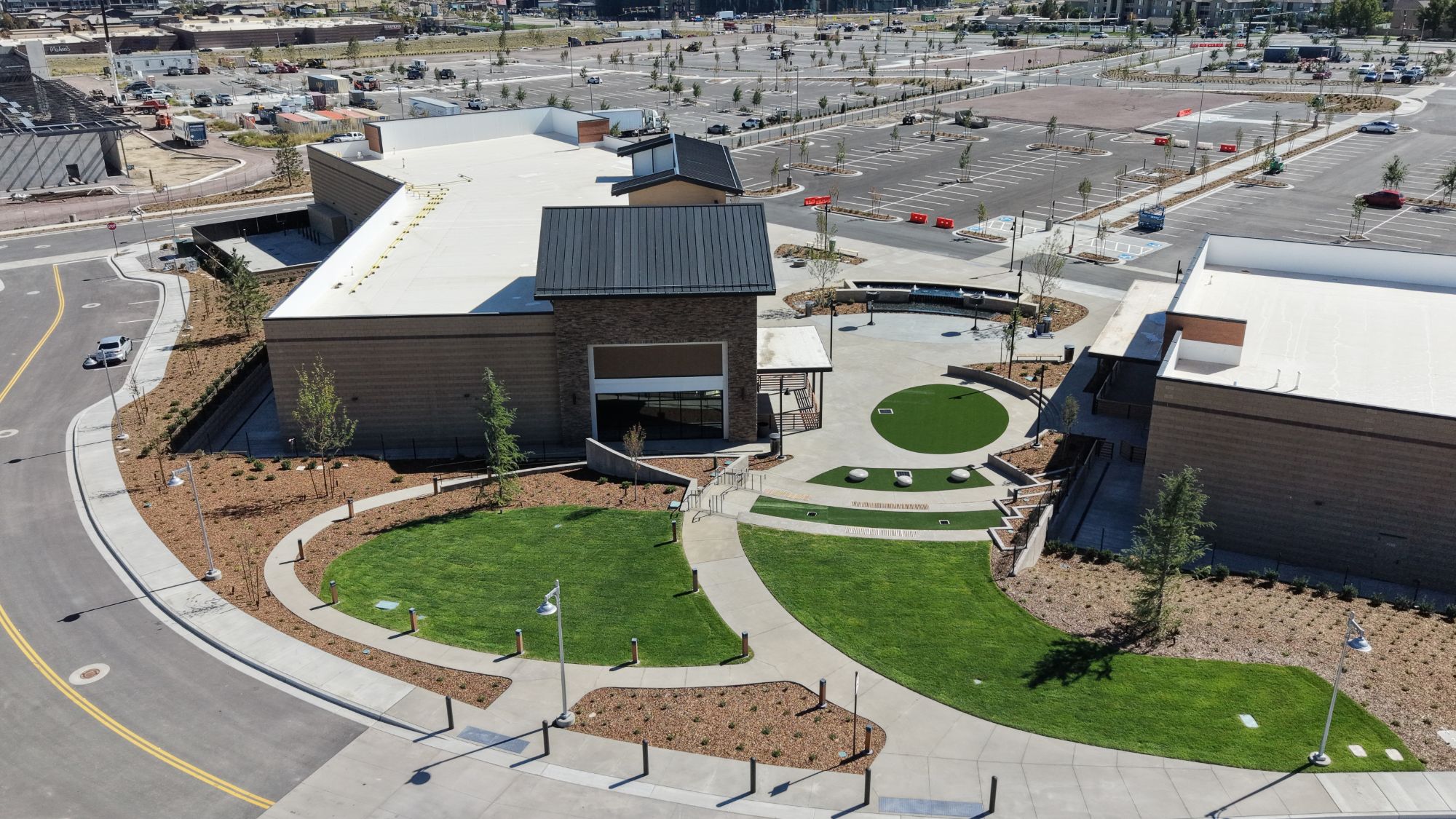 Aerial view of the pavilion building, lawns and amphitheater steps at The Commons