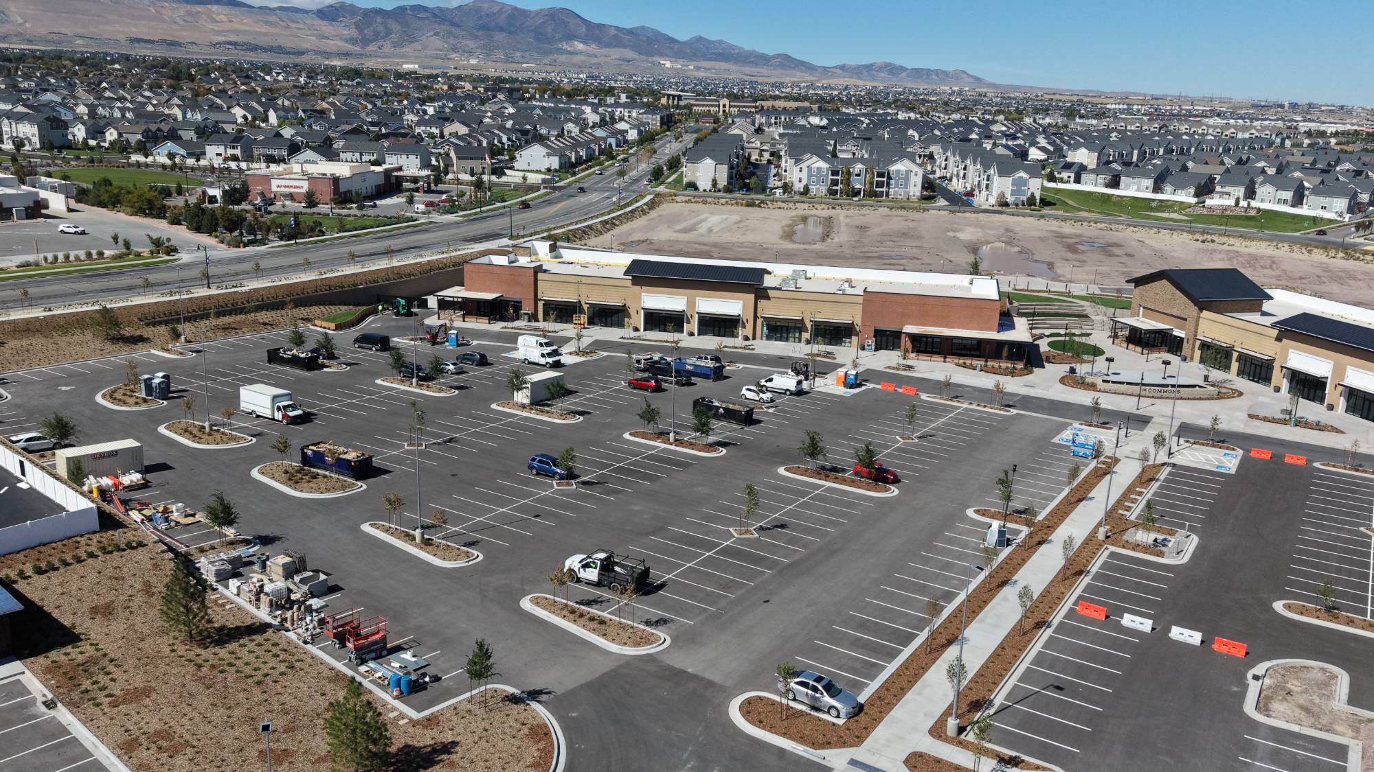 Aerial view across the parking field at The Commons toward the Oquirrh Mountains